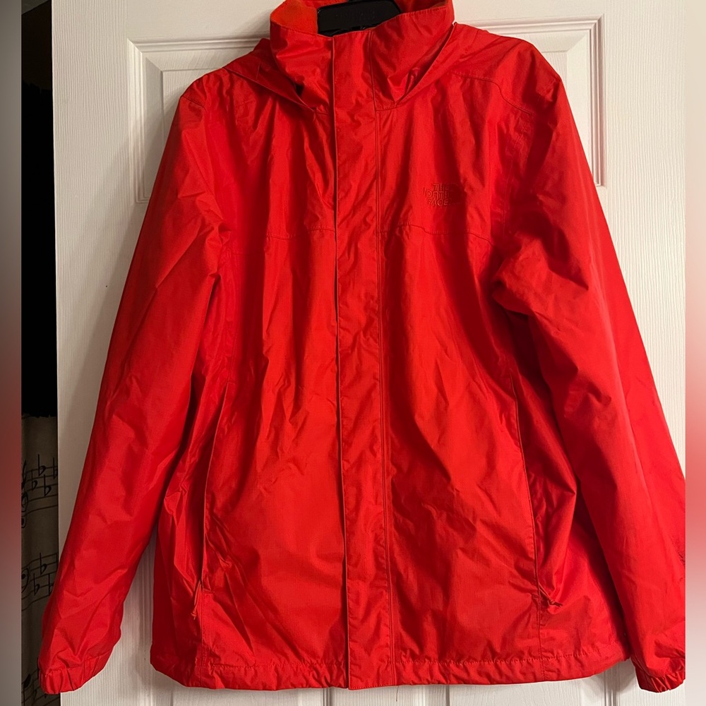 Orange Northface rain jacket with hood